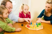 Family playing board game together Photo (4327645)